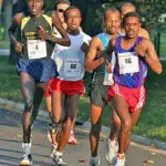 A group of men running on the road