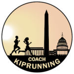 A couple of people running in front of the washington monument.