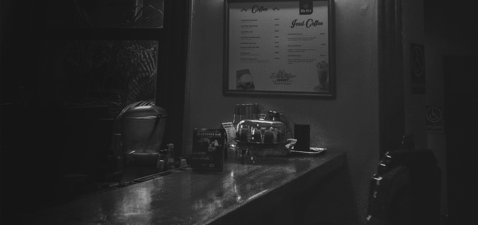 A counter with coffee and other items on it.